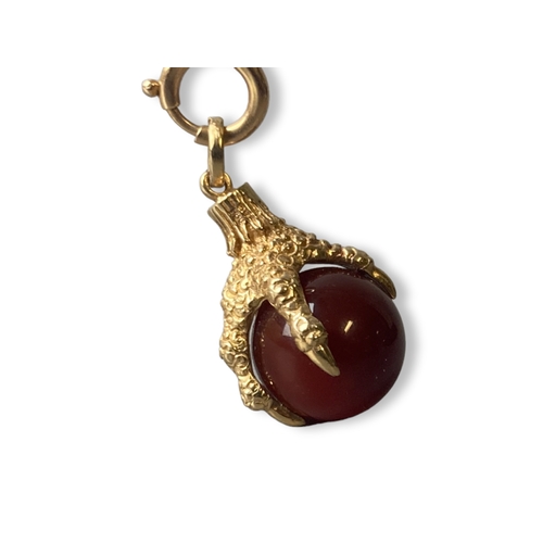 16 - A vintage 9CT Gold Eagle claw & carnelian pendant.
Approx 30mm long.
gross weight - 9.75grams.