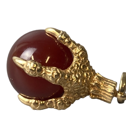 16 - A vintage 9CT Gold Eagle claw & carnelian pendant.
Approx 30mm long.
gross weight - 9.75grams.