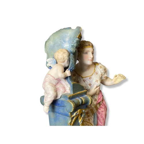 163 - A French Vion & Baury Biscuit porcelain figure group. Depicting a masked Cherub whispering in a woma... 