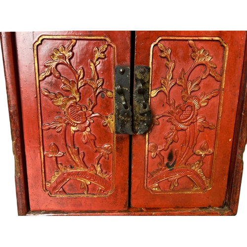 119 - A Qing dynasty Chinese carved red lacquer Scholars cabinet. Carved and gilded Dragon handle and styl... 