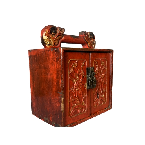 119 - A Qing dynasty Chinese carved red lacquer Scholars cabinet. Carved and gilded Dragon handle and styl... 