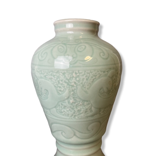 180B - A collection of Chinese porcelain. Including a Celadon vase, Opium pillow, Yixing teapot and rice pa... 