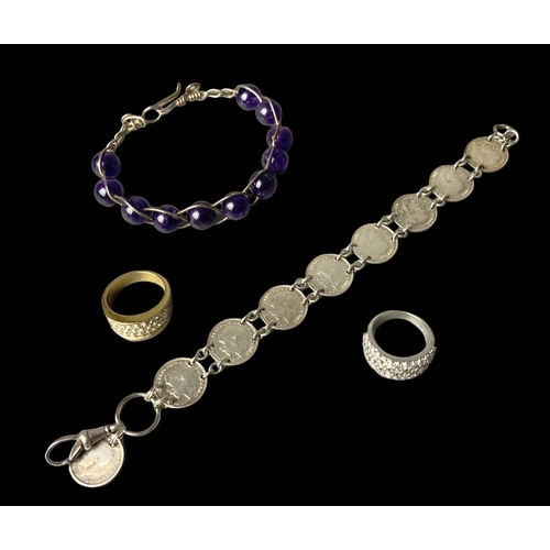 62 - A collection of vintage jewellery. Including a 1920 George V, Threepence bracelet and a Tova silver ... 