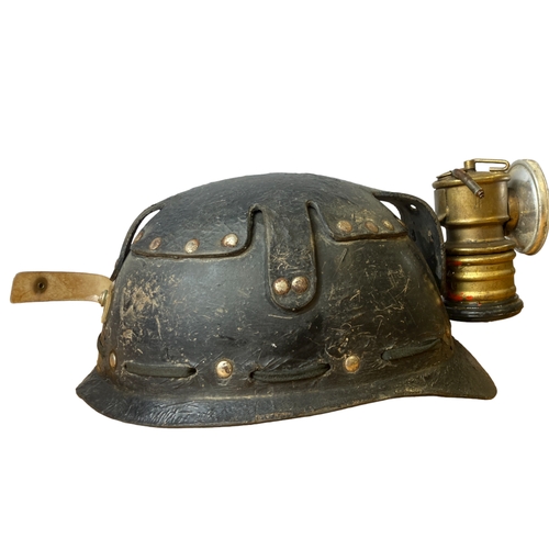 132 - A vintage Miners Helmet & lamp.