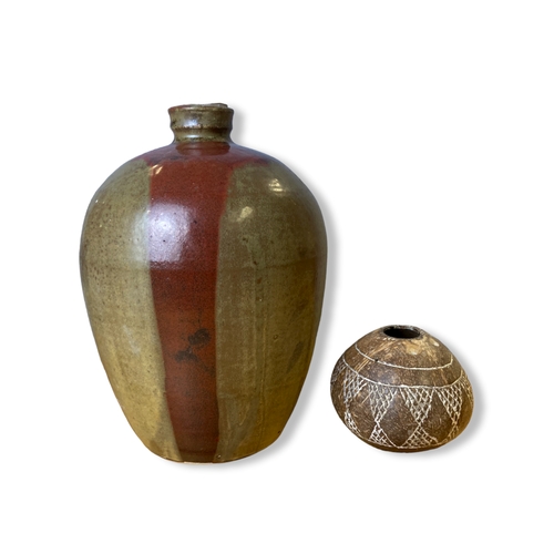 141 - A large Studio pottery vase, together with a carved cocnut.