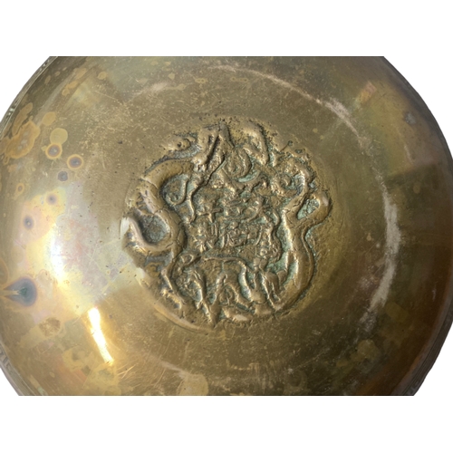 145 - Three Chinese engraved Brass bowls.