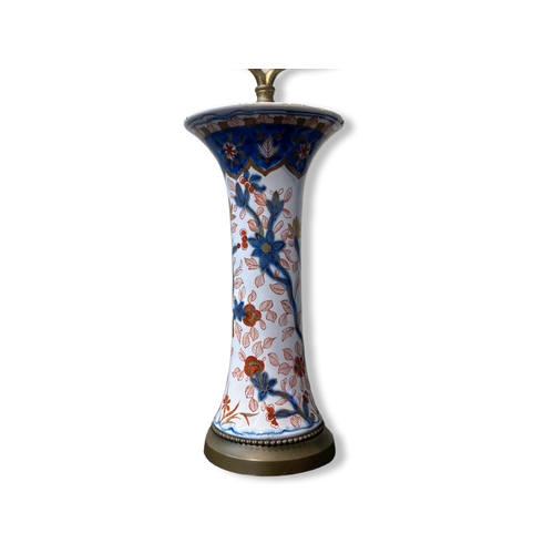 156 - A 19th-century Imari porcelain trumpet vase, fitted as a lamp. Hand-painted with exotic flowers.
Sta... 