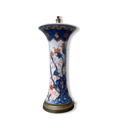 156 - A 19th-century Imari porcelain trumpet vase, fitted as a lamp. Hand-painted with exotic flowers.
Sta... 