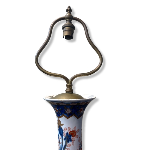 156 - A 19th-century Imari porcelain trumpet vase, fitted as a lamp. Hand-painted with exotic flowers.
Sta... 