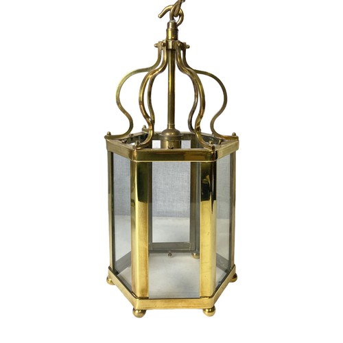 183 - Two Georgian type Polished Brass Hall lanterns. One with three branch lights inset hexagonal glass p... 