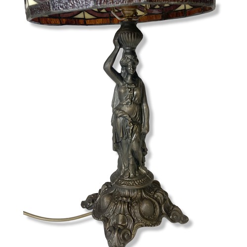 184 - A bronzed metal Tiffany style table lamp. Base in classical lady form. 
55cm tall