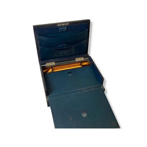 206 - An early 20th-century leather bound writing slope / stationery box. With fitted leather & wooden int... 