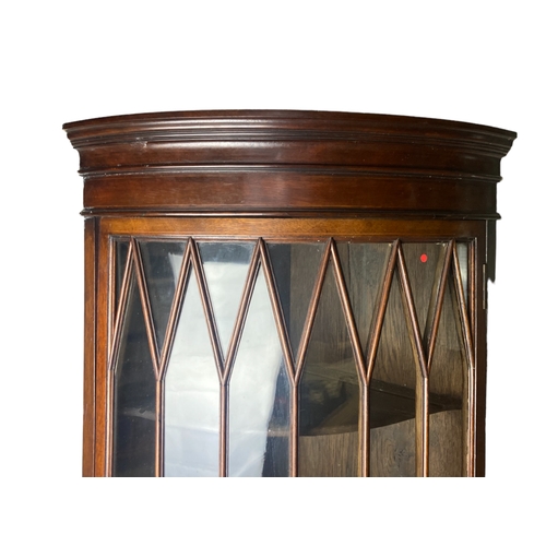 215 - A George III Mahogany glazed glass front corner cupboard.
89 x 33cm