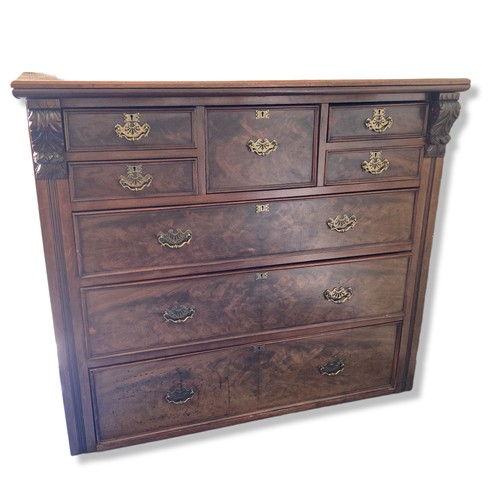 225 - A 19th-Century Mahogany Scotch Chest of Drawers. With carved finials. Square central drawer bordered... 