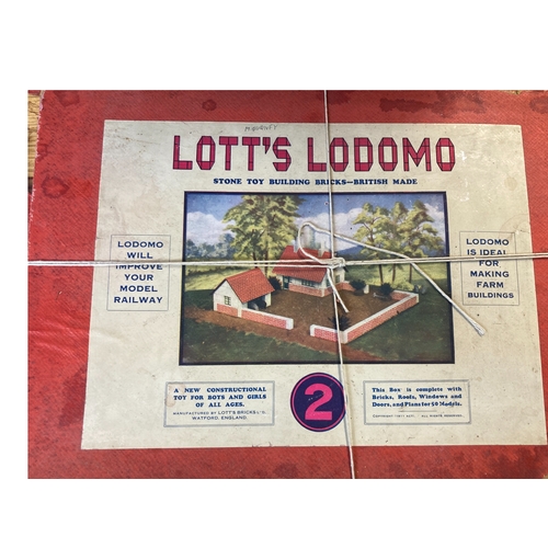 230 - Four boxed early 20th C Lotts Lodomo Tutor building blocks.