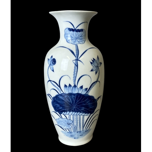 182 - A pair of Chinese porcelain hand painted vases. painted with pond Lilies.