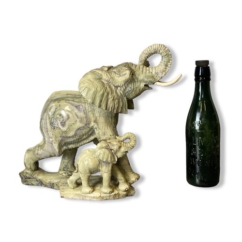 113A - A very large carved Shona Butter Jade sculpture of Elephant and calf. By Victoria Falls based artist... 