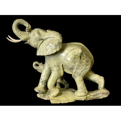 113A - A very large carved Shona Butter Jade sculpture of Elephant and calf. By Victoria Falls based artist... 