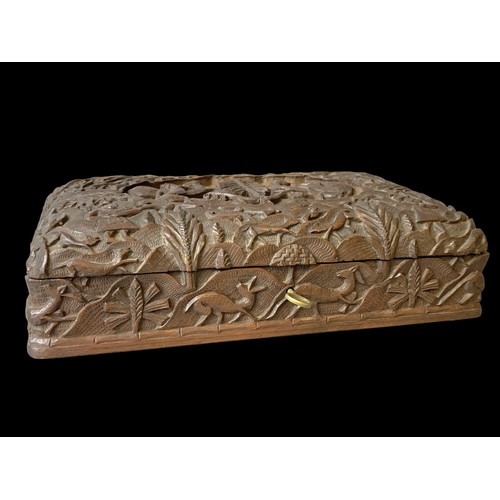 91 - A 19th-century carved Anglo Indian Sandalwood box. Elaborate hand carved Hunt scene with central sce... 