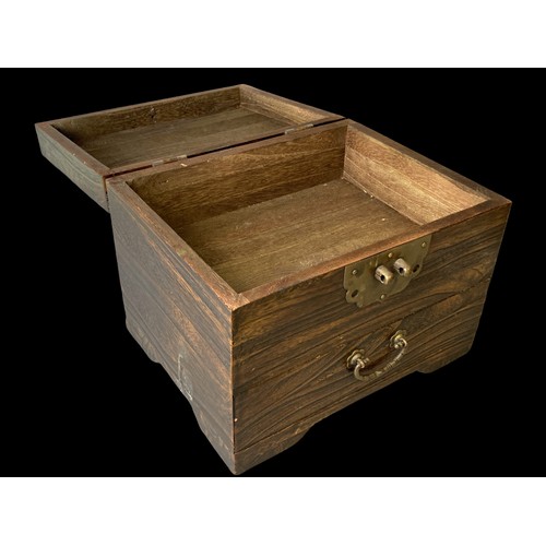 125 - A Chinese wooden Money box. Fitted with brass lock and handle.Comprises hinged lid and drawer below.... 