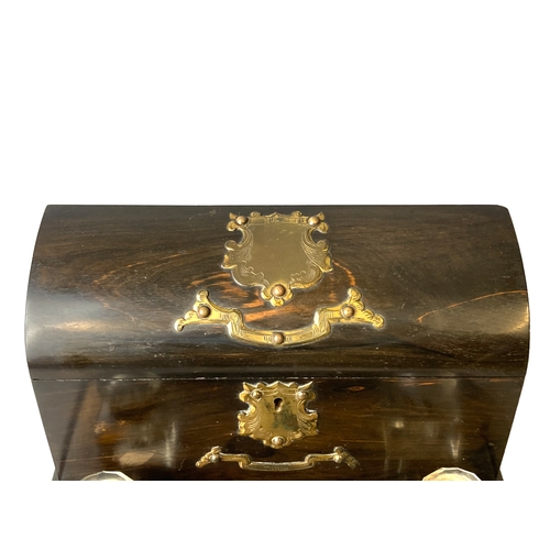 93 - Victorian Coromandel Desk stand with Inkwells and lidded letter box. With brass mounts.
30 x 24 cm