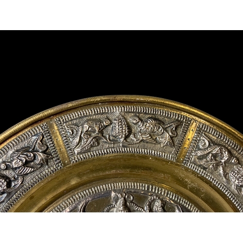 126 - Indian Silver & Brass embossed plate.
17cm Diameter