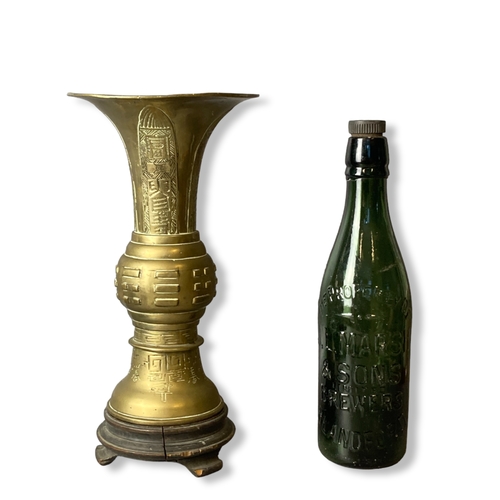 205 - Chinese Bronze / Brass Archaistic type Gu shape vase on stand.
30cm tall.