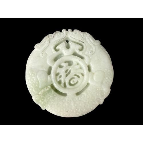 131 - Pair of Chinese carved Jade pendants.
Disc - 4.7cm diameter