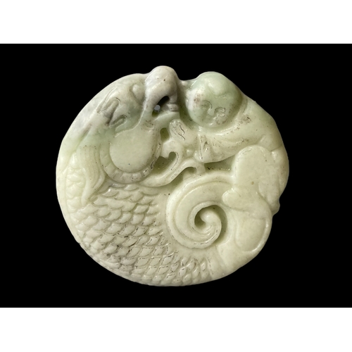 139 - Pair of Chinese carved Jade pendants.
largest - 5.3cm Diameter