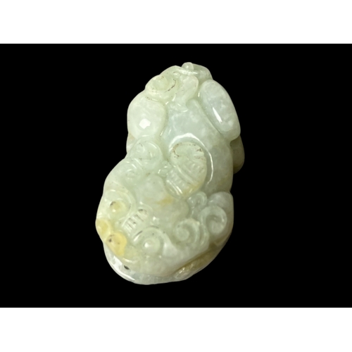 116 - Chinese carved jade Lion pendant.
3cm long.