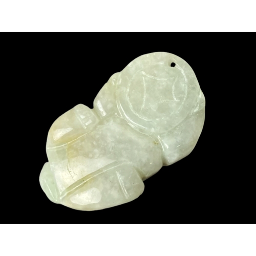 116 - Chinese carved jade Lion pendant.
3cm long.