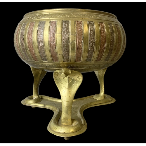 39 - A large Indian Brass bowl on Cobra stand.
28 x 30 cm