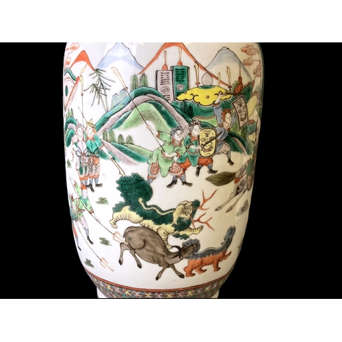 187 - A large pair of Qing dynasty Famille verte porcelain vases. Hand painted with extensive battle scene... 