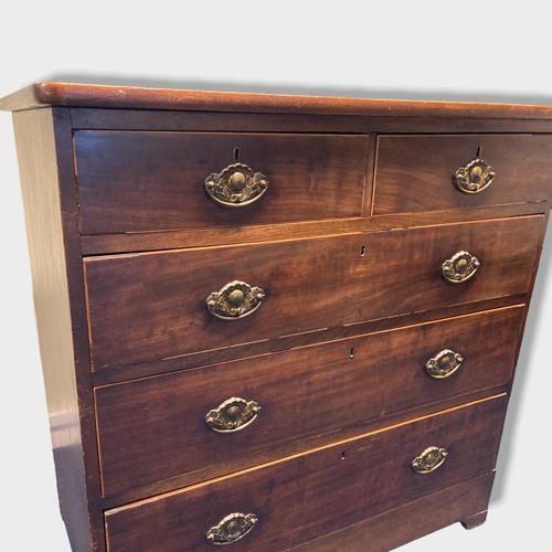 5 - A Victorian Mahogany Chest of Drawers. Three large, two small drawers. Banding and brass handles.