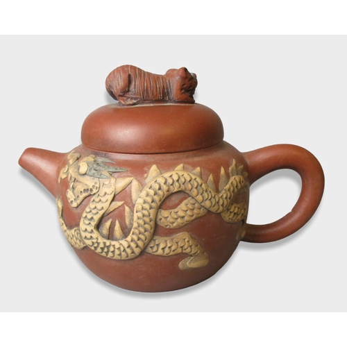 160 - Relief moulded Chinese Yixing teapot. Decorated with Dragon to one side & Phoenix to verso.
9.5 x 14... 