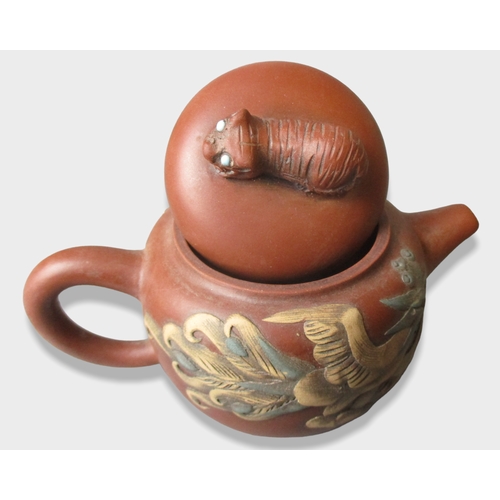 160 - Relief moulded Chinese Yixing teapot. Decorated with Dragon to one side & Phoenix to verso.
9.5 x 14... 