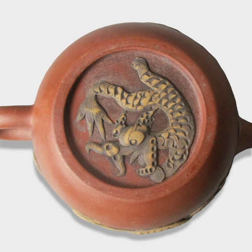 160 - Relief moulded Chinese Yixing teapot. Decorated with Dragon to one side & Phoenix to verso.
9.5 x 14... 