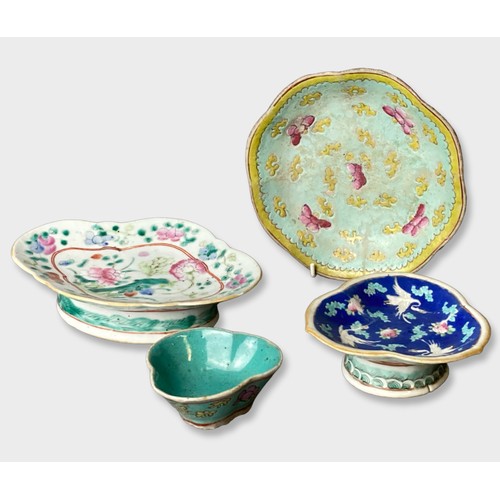 209 - A collection of 19th century Chinese porcelain dishes. Hand painted in Chinese straights style, on r... 