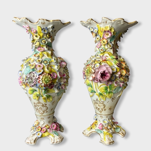 51 - A large pair of 19th century floral encrusted porcelain vases. 
31.5cm Tall