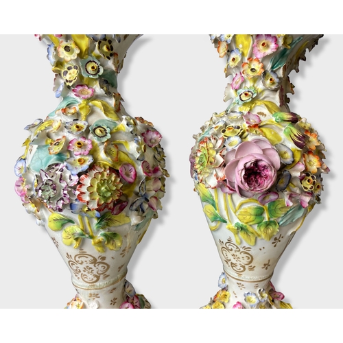 51 - A large pair of 19th century floral encrusted porcelain vases. 
31.5cm Tall