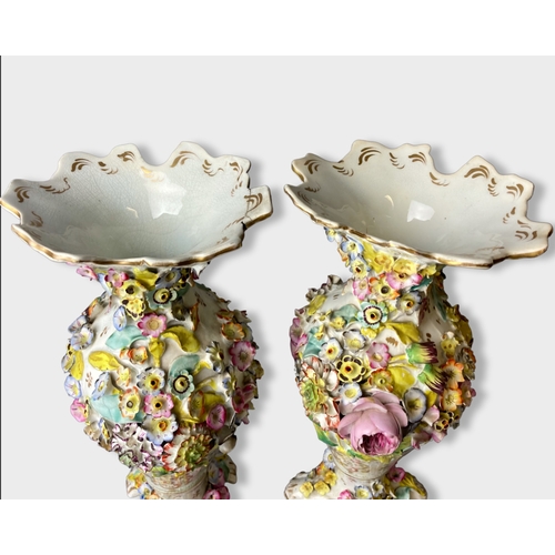 51 - A large pair of 19th century floral encrusted porcelain vases. 
31.5cm Tall