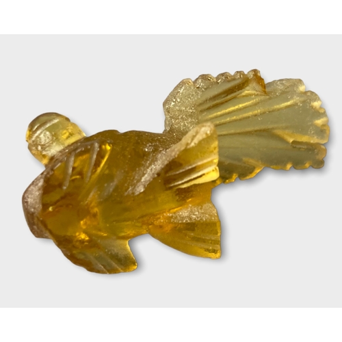 144 - Four Chinese Amber glass fish figures & a tortoise.
Tortoise - 4 x2 cm