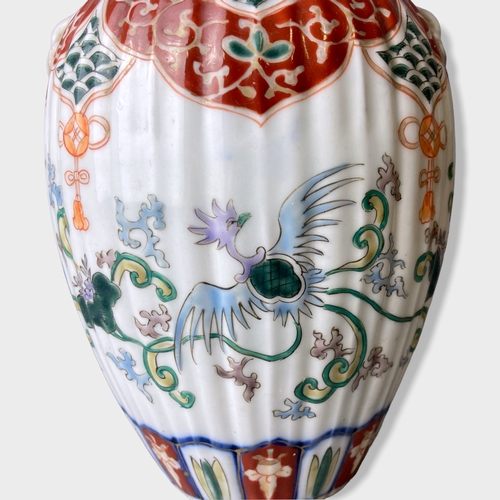 151 - A Japanese Edo period Arita Imari porcelain vase & cover. Hand painted with phoenix and scrolling st... 