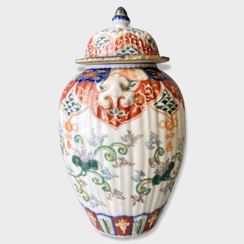 151 - A Japanese Edo period Arita Imari porcelain vase & cover. Hand painted with phoenix and scrolling st... 