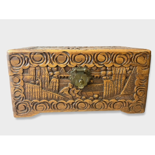 121 - A Chinese carved Camphor wood Box.
25 x 15 x 12cm