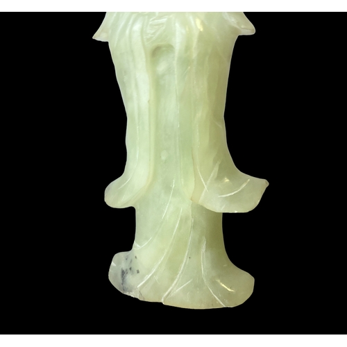 72 - A Chinese carved Jade Guanyin figure. 
17cm tall