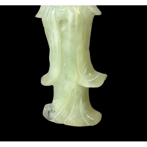 72 - A Chinese carved Jade Guanyin figure. 
17cm tall