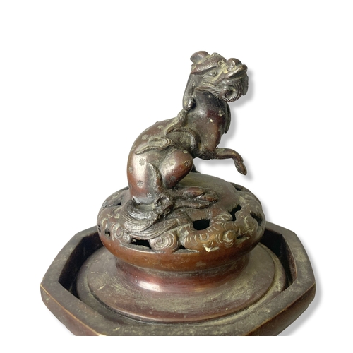 77 - A 19th-century Japanese Bronze vase. Raised on greek-key feet, with relief decorated Dragons & Phoen... 