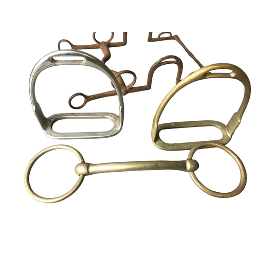 86 - a collection of Horse parehphenalia including bits and Stirrup