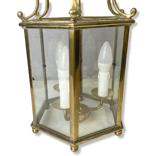106 - Two Georgian type Polished Brass Hall lanterns. One with three branch lights inset hexagonal glass p... 